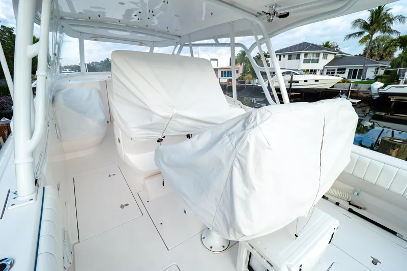  Yacht Photos Pics 2019 Intrepid 407 Cuddy boat interior with covered seating and sleek design.