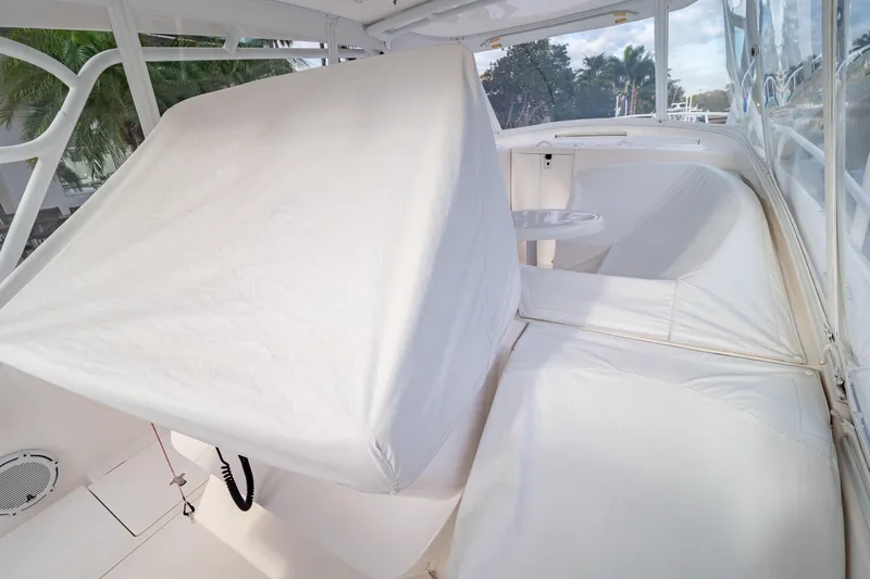  Yacht Photos Pics 2019 Intrepid 407 Cuddy interior with white seating and table.