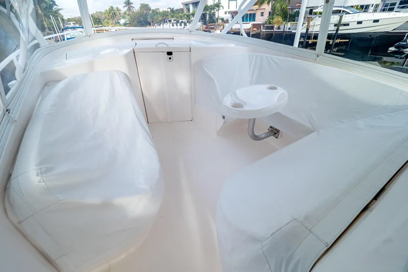  Yacht Photos Pics 2019 Intrepid 407 Cuddy interior with white seating and small table.