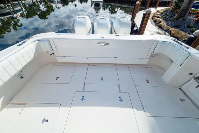  Yacht Photos Pics 2019 Intrepid 407 Cuddy boat deck with storage compartments and seating.