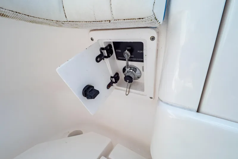  Yacht Photos Pics Control panel on a 2019 Intrepid 407 Cuddy boat, featuring switches and key access.