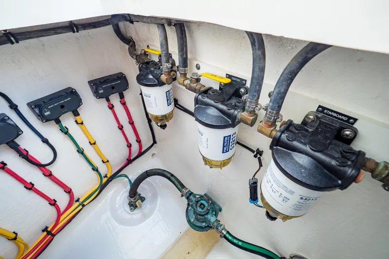  Yacht Photos Pics Engine compartment of 2019 Intrepid 407 Cuddy with fuel filters and color-coded wiring.