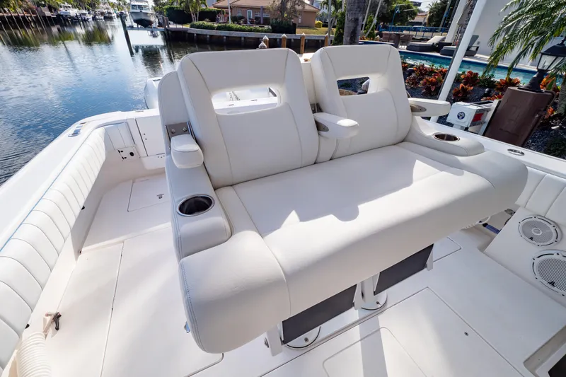  Yacht Photos Pics 2019 Intrepid 407 Cuddy boat interior with plush seating and cup holders.