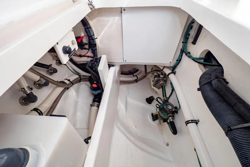  Yacht Photos Pics Interior view of 2019 Intrepid 407 Cuddy boat's engine compartment with visible wiring and hoses.