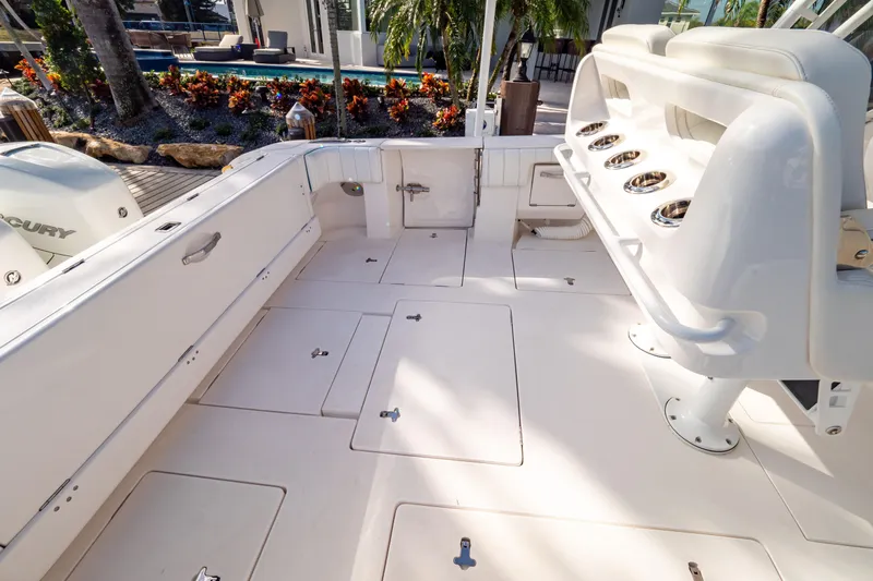  Yacht Photos Pics 2019 Intrepid 407 Cuddy boat deck with seating and storage compartments.