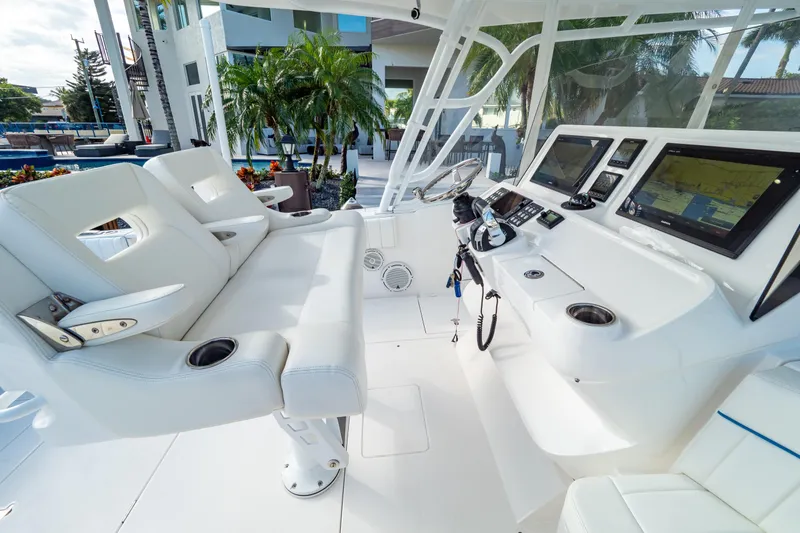  Yacht Photos Pics 2019 Intrepid 407 Cuddy boat interior with modern helm and seating.