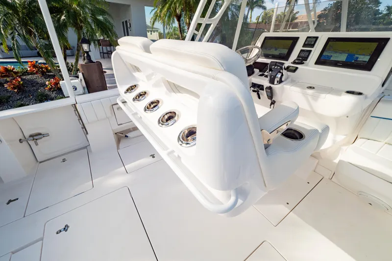  Yacht Photos Pics 2019 Intrepid 407 Cuddy boat interior with helm, seating, and navigation displays.