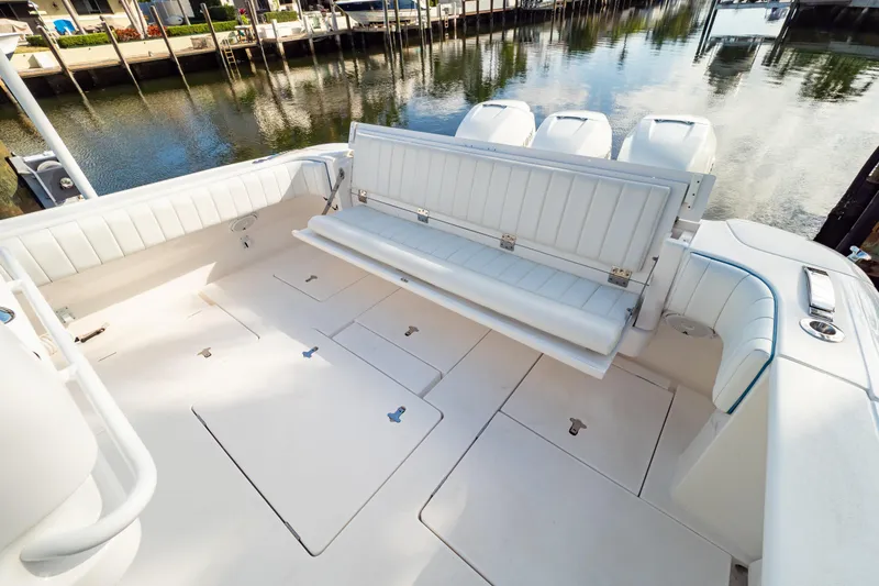  Yacht Photos Pics 2019 Intrepid 407 Cuddy boat interior with foldable seating and spacious deck.