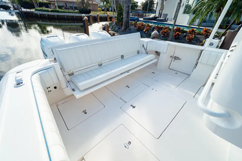  Yacht Photos Pics 2019 Intrepid 407 Cuddy boat interior with white seating and storage compartments.