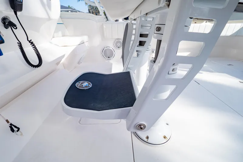  Yacht Photos Pics 2019 Intrepid 407 Cuddy boat interior with seating and communication equipment.