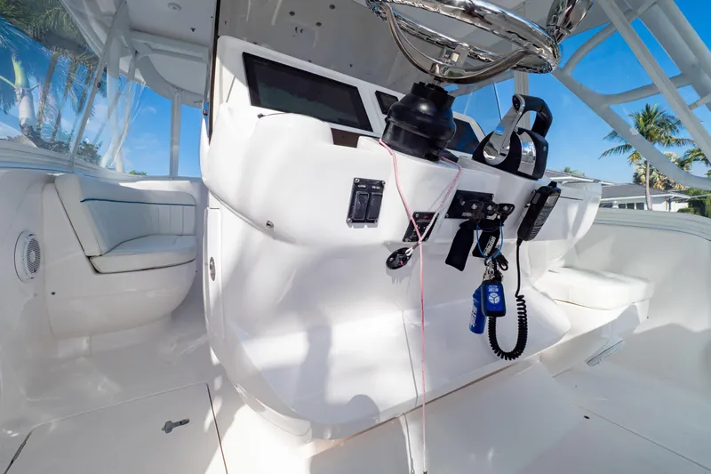  Yacht Photos Pics 2019 Intrepid 407 Cuddy helm with modern controls and seating, showcasing luxury design.