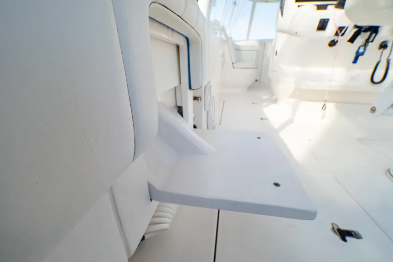  Yacht Photos Pics 2019 Intrepid 407 Cuddy interior with white seating and fold-out table.