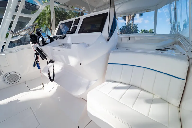  Yacht Photos Pics 2019 Intrepid 407 Cuddy boat interior with white seating and modern dashboard.