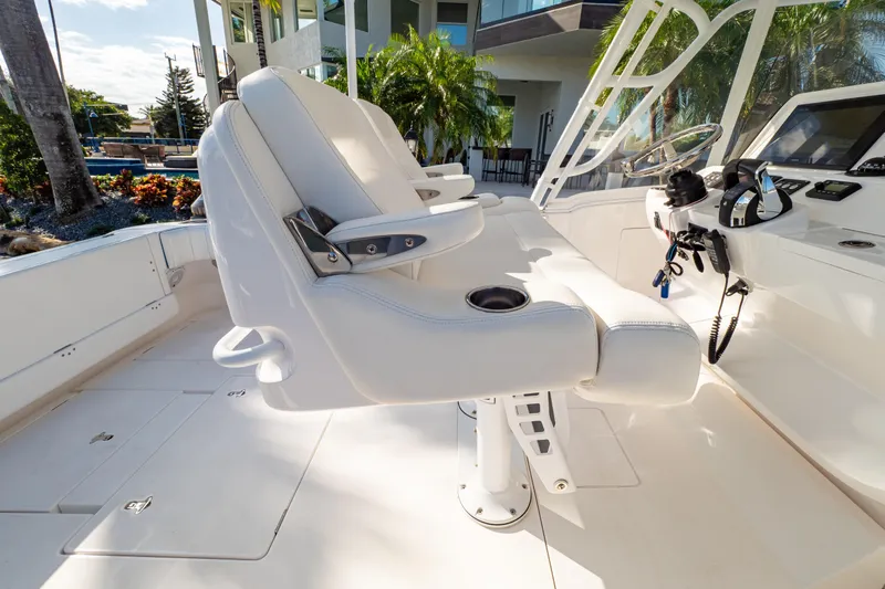  Yacht Photos Pics 2019 Intrepid 407 Cuddy boat interior with white seating and modern controls.