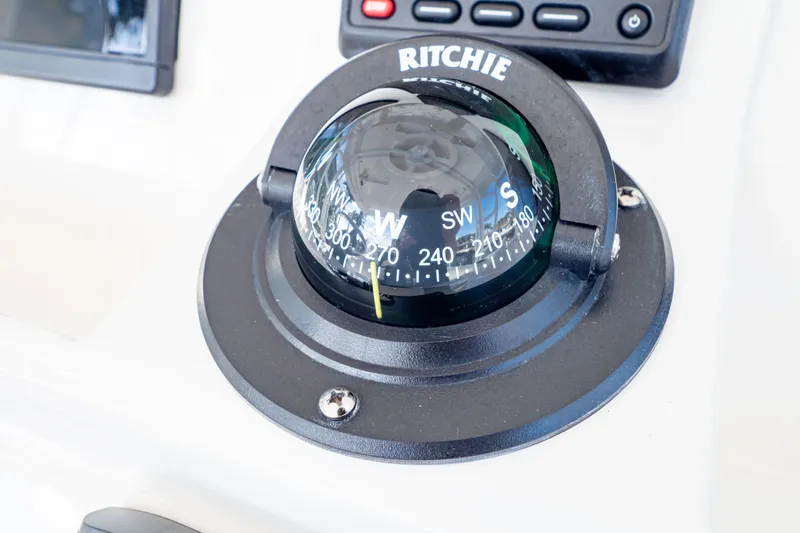  Yacht Photos Pics Compass on 2019 Intrepid 407 Cuddy boat dashboard, showing navigation directions.