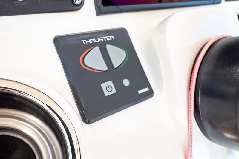  Yacht Photos Pics Control panel of a 2019 Intrepid 407 Cuddy boat, featuring thruster buttons.