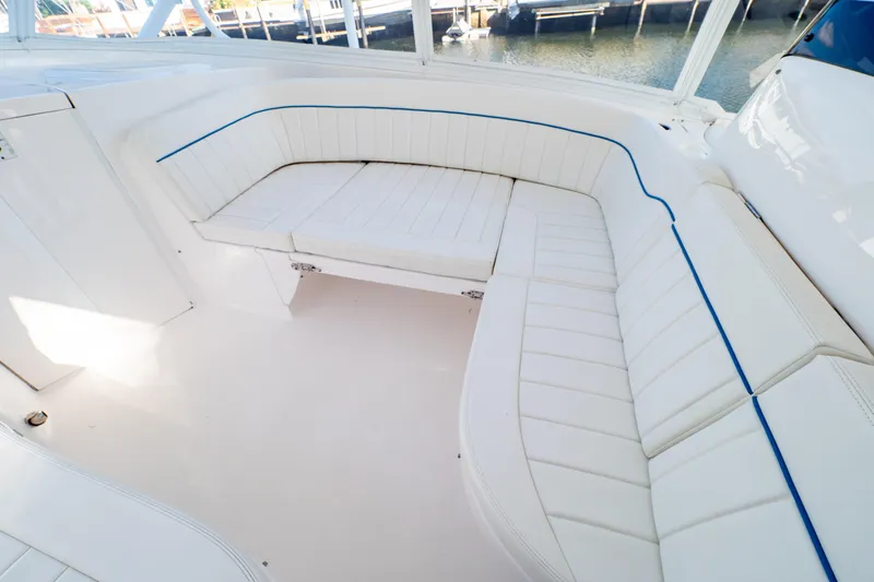  Yacht Photos Pics 2019 Intrepid 407 Cuddy boat interior with white cushioned seating and blue accents.