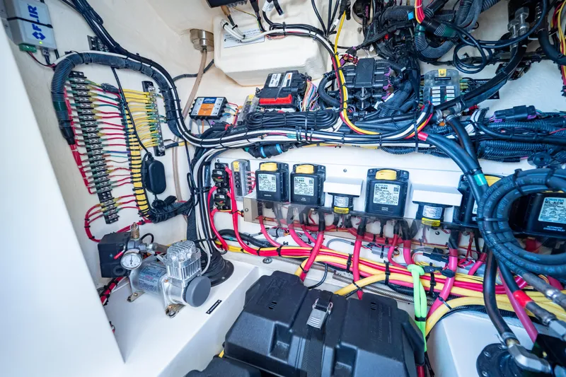  Yacht Photos Pics Electrical system of a 2019 Intrepid 407 Cuddy boat, showcasing wiring and components.