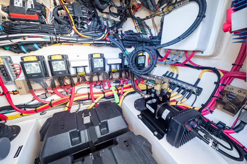  Yacht Photos Pics Electrical system of a 2019 Intrepid 407 Cuddy boat, showcasing wiring and components.
