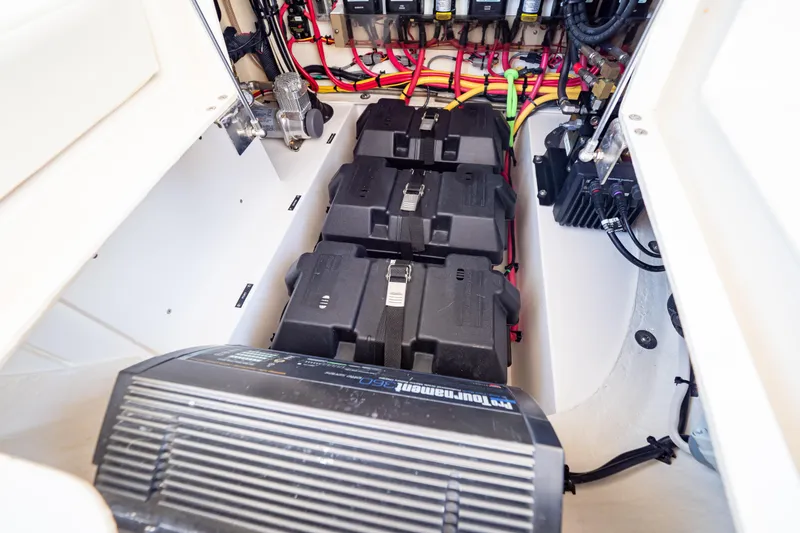  Yacht Photos Pics Electrical system of a 2019 Intrepid 407 Cuddy boat, featuring batteries and wiring.