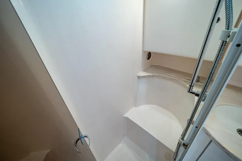  Yacht Photos Pics 2019 Intrepid 407 Cuddy interior shower area with modern design and fixtures.