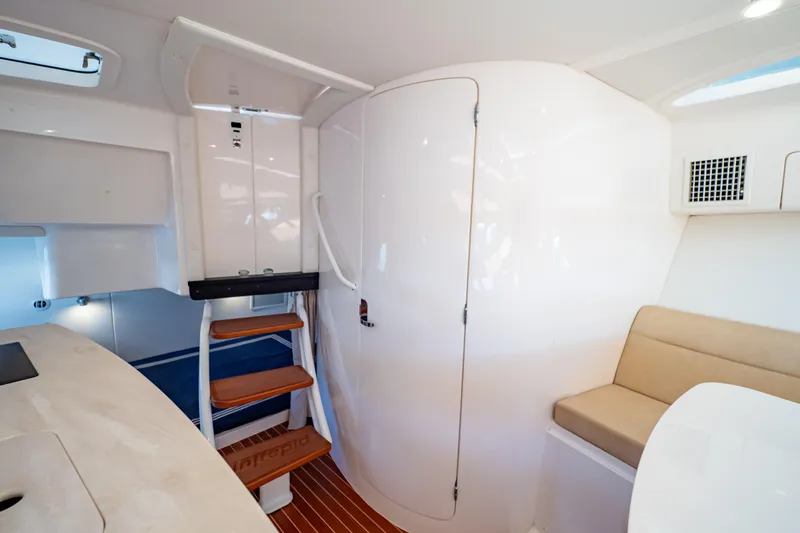  Yacht Photos Pics Interior of 2019 Intrepid 407 Cuddy boat with seating and stairs.