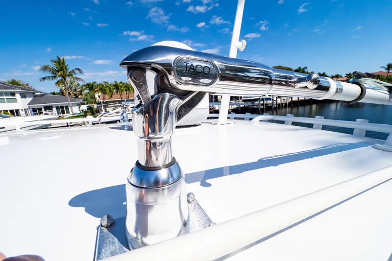  Yacht Photos Pics Close-up of a 2019 Intrepid 407 Cuddy boat's polished metal fitting under a clear blue sky.