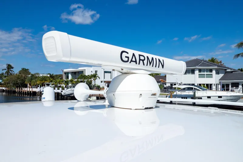  Yacht Photos Pics 2019 Intrepid 407 Cuddy with Garmin radar, docked near waterfront homes.