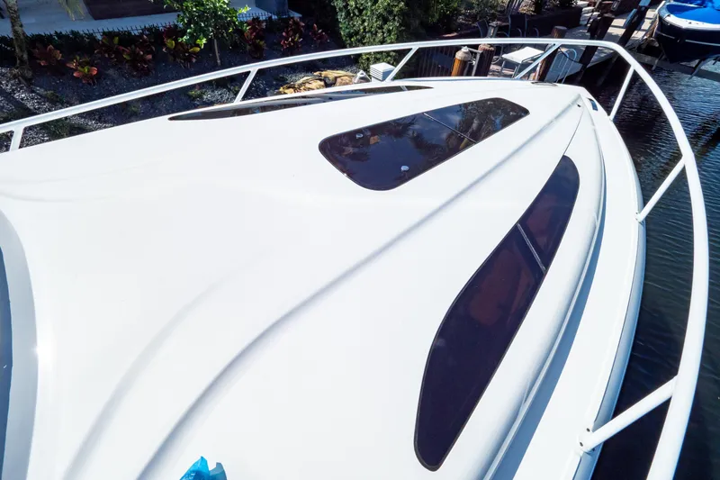  Yacht Photos Pics 2019 Intrepid 407 Cuddy boat deck with sleek design and tinted windows.