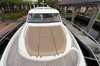 2020 Nimbus 405 Coupé yacht docked, featuring spacious deck and sleek design.