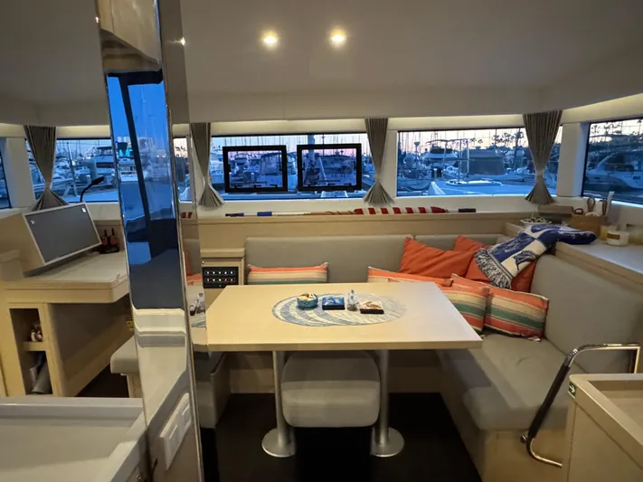 Encore Yacht Photos Pics Interior of 2021 Lagoon 40 catamaran with cozy seating and nautical decor.