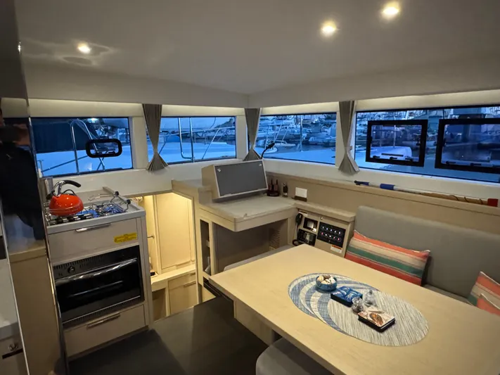 Encore Yacht Photos Pics Interior of 2021 Lagoon 40 catamaran with modern kitchen and dining area.