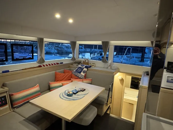 Encore Yacht Photos Pics Interior of 2021 Lagoon 40 catamaran with cozy seating and modern decor.