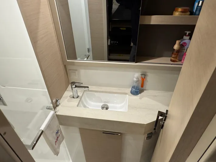 Encore Yacht Photos Pics Bathroom interior of 2021 Lagoon 40 yacht with sink and mirror.