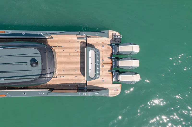  Yacht Photos Pics Aerial view of 2025 Buddy Davis PININFARINA 47 CC yacht on turquoise water.