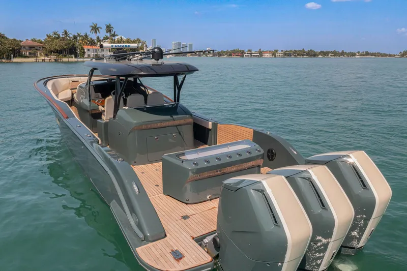  Yacht Photos Pics Luxury 2025 Buddy Davis PININFARINA 47 CC boat with triple engines on calm water.