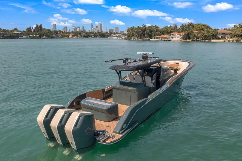  Yacht Photos Pics 2025 Buddy Davis PININFARINA 47 CC boat on calm water with city skyline.
