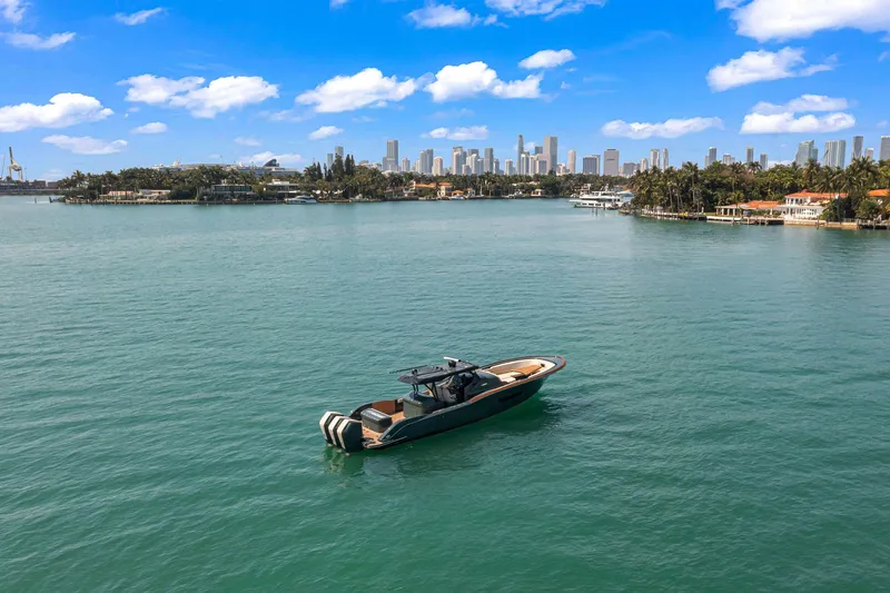  Yacht Photos Pics Buddy Davis PININFARINA 47 CC boat on water with city skyline in background, 2025 model.