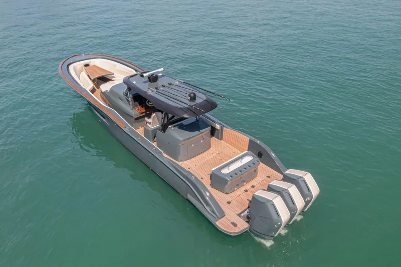  Yacht Photos Pics 2025 Buddy Davis PININFARINA 47 CC boat on calm water, featuring sleek design and triple engines.