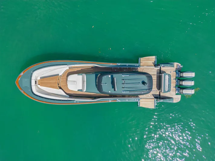  Yacht Photos Pics Aerial view of 2025 Buddy Davis PININFARINA 47 CC yacht on turquoise water.