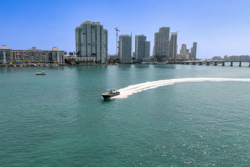  Yacht Photos Pics Boat cruising near city skyline, Buddy Davis PININFARINA 47 CC, 2025 model.