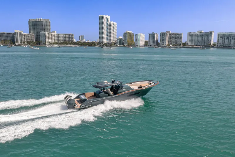  Yacht Photos Pics 2025 Buddy Davis PININFARINA 47 CC cruising in coastal city waters.