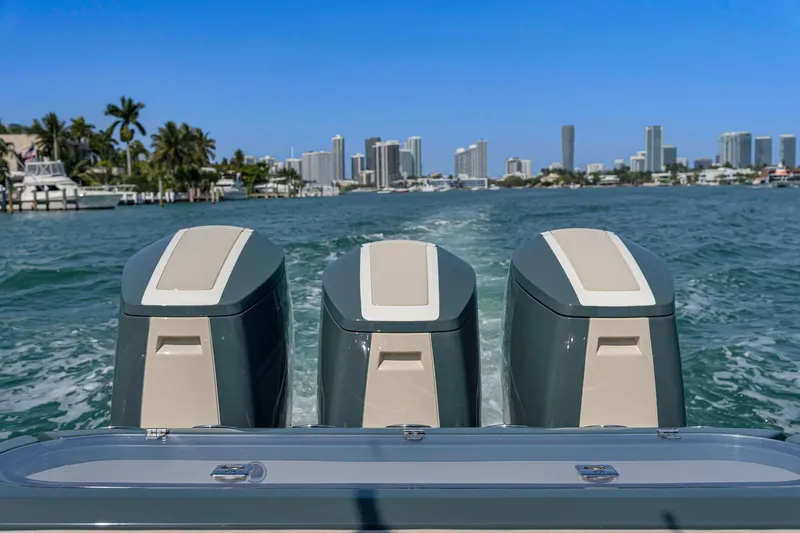  Yacht Photos Pics 2025 Buddy Davis PININFARINA 47 CC boat engines cruising on a sunny day.