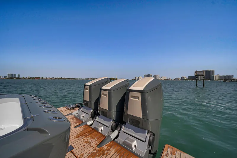  Yacht Photos Pics 2025 Buddy Davis PININFARINA 47 CC boat with triple outboard motors on a sunny day.