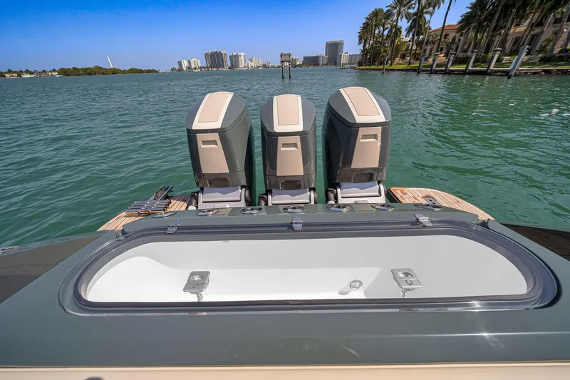  Yacht Photos Pics 2025 Buddy Davis PININFARINA 47 CC boat with triple outboard engines on a sunny day.
