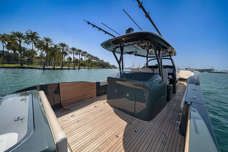  Yacht Photos Pics 2025 Buddy Davis PININFARINA 47 CC luxury boat on serene water with palm trees.