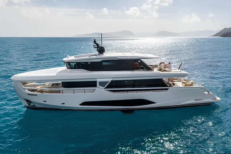  Yacht Photos Pics 2025 Ferretti Yachts INFYNITO 90 cruising on serene blue ocean waters.