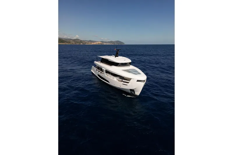  Yacht Photos Pics 2025 Ferretti Yachts INFYNITO 90 cruising on open sea under clear sky.