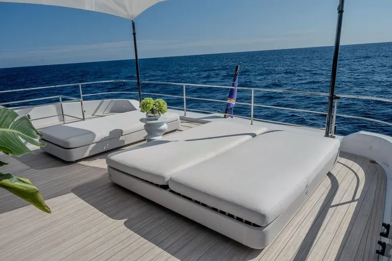  Yacht Photos Pics Luxurious deck of 2025 Ferretti Yachts INFYNITO 90 with ocean view and sun loungers.