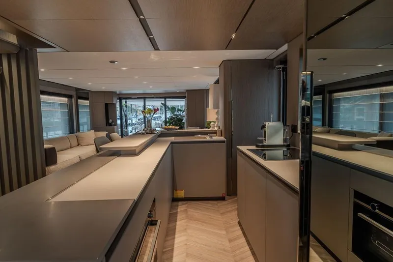  Yacht Photos Pics Luxurious interior of 2025 Ferretti Yachts INFYNITO 90, featuring modern kitchen and elegant living area.